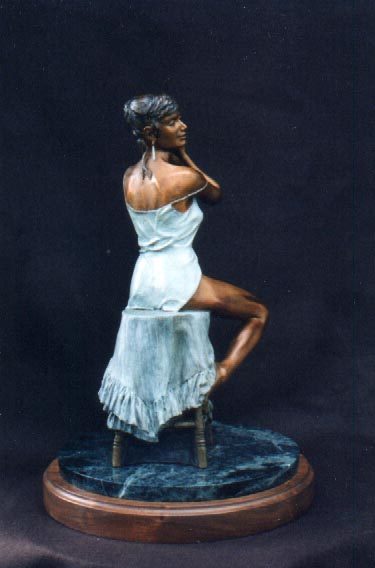 Limited edition bronze 18"h x 14" x 14"   Very realistic and detailed view into the private world of a woman alone at her dressing table as she selects a pair of earrings.